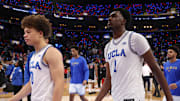 Nov 14, 2025; Inglewood, California, USA;  UCLA Bruins guard Trent Perry (0) and center Xavier Booker (1) leave the court after defeated by the Arizona Wildcats 69-65 at Intuit Dome. Mandatory Credit: Kiyoshi Mio-Imagn Images