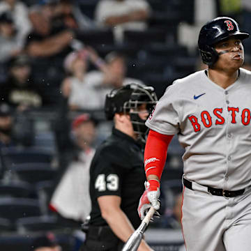 Jun 8, 2025; Bronx, New York, USA; Boston Red Sox designated hitter Rafael Devers (11) reacts after hitting a solo home run against the New York Yankees during the ninth inning at Yankee Stadium. 