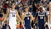 Gonzaga players Braden Huff (34), Davis Fogle (4) and Ismaila Diagne (24).