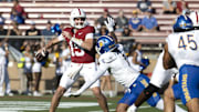 Sep 27, 2025; Stanford, California, USA;  Stanford Cardinal quarterback Ben Gulbranson (15) throws the ball during the first quarter against San Jose State Spartans linebacker Jordan Pollard (1) at Stanford Stadium. Mandatory Credit: Stan Szeto-Imagn Images

