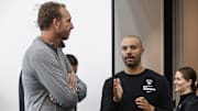 Sep 30, 2024; Brooklyn, NY, USA;  Brooklyn Nets General Manager Sean Marks (left) speaks to head coach Jordi Fernandez (right) during media day at HSS Training Center. Mandatory Credit: Wendell Cruz-Imagn Images