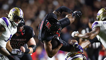 Sep 27, 2024; Piscataway, New Jersey, USA; Rutgers Scarlet Knights wide receiver Ian Strong (9) is tackled by Washington Huskies defensive back Rahshawn Clark (20) during the first half at SHI Stadium. Mandatory Credit: Vincent Carchietta-Imagn Images