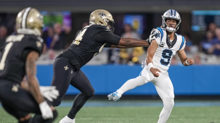 Sep 18, 2023; Charlotte, North Carolina, USA; Carolina Panthers quarterback Bryce Young (9) throws under pressure from New Orleans Saints defensive end Cameron Jordan (94) during the first quarter at Bank of America Stadium.