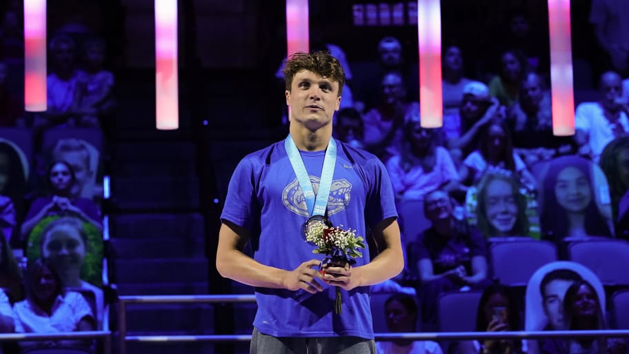 Bobby Finke celebrates his victory in the men's 800 freestyle during the medal ceremony at the U.S. Olympic Team Trials.