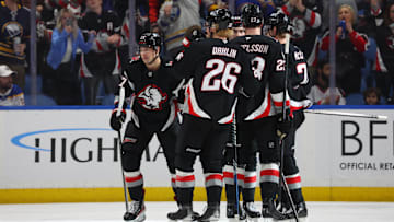 Apr 17, 2025; Buffalo, New York, USA;  Buffalo Sabres right wing JJ Peterka (77) celebrates his goal with teammates during the third period against the Philadelphia Flyers at KeyBank Center. Mandatory Credit: Timothy T. Ludwig-Imagn Images