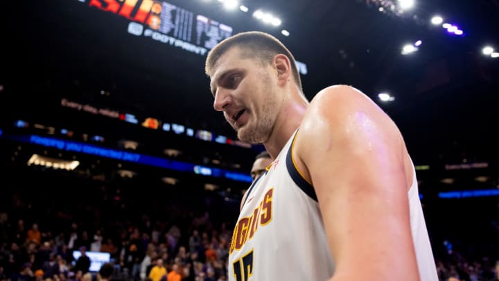 Dec 1, 2023; Phoenix, Arizona, USA; Denver Nuggets center Nikola Jokic (15) reacts against the Phoenix Suns in the first half at Footprint Center. 