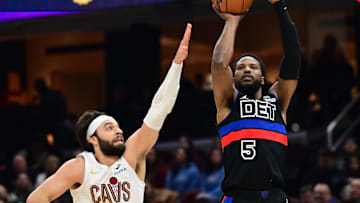 Jan 27, 2025; Cleveland, Ohio, USA; Detroit Pistons guard Malik Beasley (5) shoots over the defense of  Cleveland Cavaliers guard Max Strus (1) during the first half at Rocket Mortgage FieldHouse. Mandatory Credit: Ken Blaze-Imagn Images