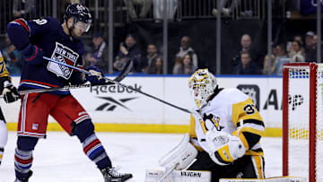 Feb 7, 2025; New York, New York, USA; Pittsburgh Penguins goaltender Alex Nedeljkovic (39) makes a save in front of New York Rangers left wing Will Cuylle (50) during the second period at Madison Square Garden. Mandatory Credit: Brad Penner-Imagn Images