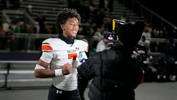 West Des Moines Valley sophomore Jayden McGregory (7) is interviewed by KCCI   s Shannon Ehrhardt after the Tigers beat Waukee, 20-7, during a high school football game in Waukee on Friday, Nov. 3, 2023.