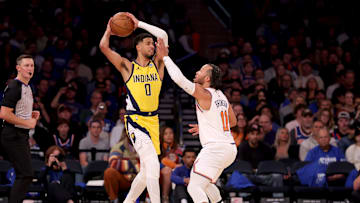 Indiana Pacers guard Tyrese Haliburton looks to pass the ball against New York Knicks guard Jalen Brunson.