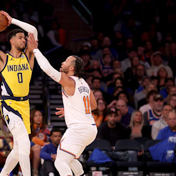 Indiana Pacers guard Tyrese Haliburton looks to pass the ball against New York Knicks guard Jalen Brunson. Mandatory Credit: Brad Penner-Imagn Images
