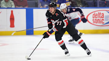 Feb 4, 2025; Buffalo, New York, USA;  Buffalo Sabres right wing JJ Peterka (77) skates up ice with the puck during the first period against the Columbus Blue Jackets at KeyBank Center. Mandatory Credit: Timothy T. Ludwig-Imagn Images
