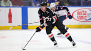 Feb 4, 2025; Buffalo, New York, USA;  Buffalo Sabres right wing JJ Peterka (77) skates up ice with the puck during the first period against the Columbus Blue Jackets at KeyBank Center. Mandatory Credit: Timothy T. Ludwig-Imagn Images