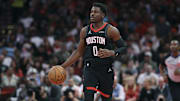 Nov 21, 2025; Houston, Texas, USA; Houston Rockets guard Aaron Holiday (0) dribbles the ball during the first half against the Denver Nuggets at Toyota Center. Mandatory Credit: Troy Taormina-Imagn Images