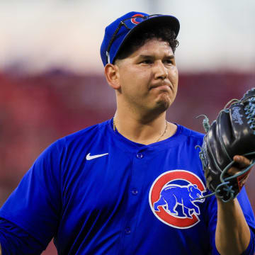 Jun 6, 2024; Cincinnati, Ohio, USA; Chicago Cubs starting pitcher Javier Assad (72) walks off the field during a pitching change in the sixth inning against the Cincinnati Reds at Great American Ball Park.