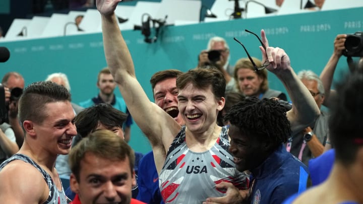 Jul 29, 2024; Paris, France; Stephen Nedoroscik reacts with teammates after he performs on the pommel horse during the men’s team final during the Paris 2024 Olympic Summer Games at Bercy Arena.