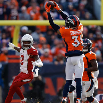 Denver Broncos safety Justin Simmons (31) intercepts a pass against the Arizona Cardinals