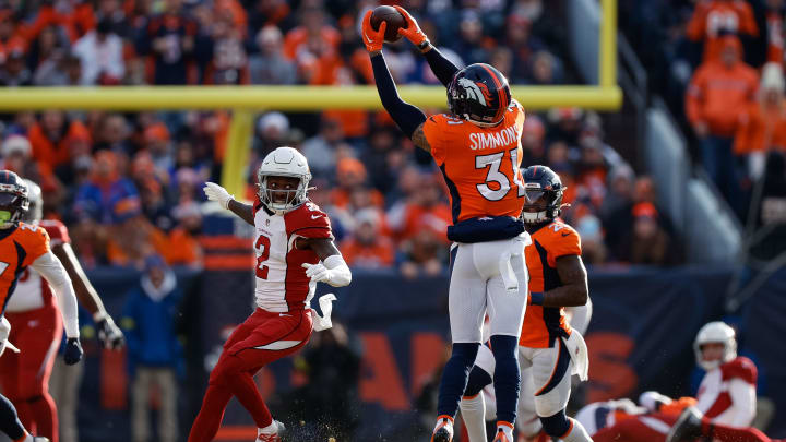 Denver Broncos safety Justin Simmons (31) intercepts a pass against the Arizona Cardinals