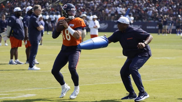 Caleb Williams tries to get off a pass during quarterback pass rush drills in training camp at Saturday's Bears practice.