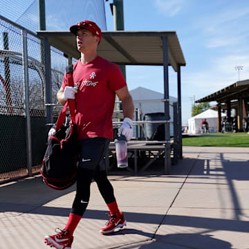 Cincinnati Reds shortstop Matt McLain (9) walks to take live batting practice during spring training workouts, Thursday, Feb. 15, 2024, at the team   s spring training facility in Goodyear, Ariz.