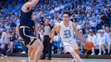 Nov 18, 2025; Chapel Hill, North Carolina, USA; North Carolina Tar Heels guard Luka Bogavac (44) drives to the basket against the Navy Midshipmen during the second half at Dean E. Smith Center. 