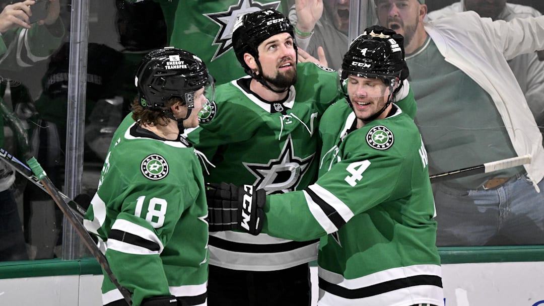 Feb 4, 2026; Dallas, Texas, USA; Dallas Stars left wing Jamie Benn (14) and center Sam Steel (18) and defenseman Miro Heiskanen (4) celebrate after Benn scores the game winning goal against the St. Louis Blues during the third period at the American Airlines Center. Mandatory Credit: Jerome Miron-Imagn Images