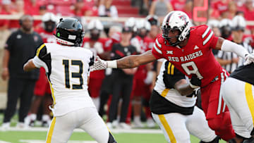 Aug 30, 2025; Lubbock, Texas, USA;  Texas Tech Red Raiders Romello Height (9) pressures Arkansas-Pine Bluff Golden Lions quarterback Landon Holcomb (13) in the first half at Jones AT&T Stadium. Mandatory Credit: Michael C. Johnson-Imagn Images