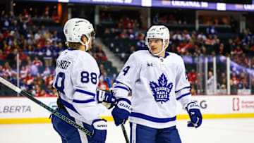 Feb 4, 2025; Calgary, Alberta, CAN; Toronto Maple Leafs right wing William Nylander (88) celebrates his goal with teammates against the Calgary Flames during the third period at Scotiabank Saddledome. Mandatory Credit: Sergei Belski-Imagn Images