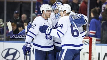 Feb 28, 2025; New York, New York, USA;  Toronto Maple Leafs goaltender Anthony Stolarz (41) celebrates with defenseman Jake McCabe (22) and center David Kampf (64) after defeating the New York Rangers at Madison Square Garden. Mandatory Credit: Wendell Cruz-Imagn Images