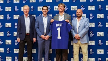 Apr 25, 2025; East Rutherford, NJ, US; New York Giants president John Mara (far left), general manager Joe Schoen (left), Jaxson Dart, and head coach Brian Daboll (right) pose for photos prior to the start of the press conference to introduce the Giants first round draft picks.  Mandatory Credit: Thomas Salus-Imagn Images