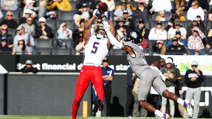 Nov 11, 2023; Boulder, Colorado, USA; Arizona Wildcats wide receiver Montana Lemonious-Craig (5) pulls in a reception against Colorado Buffaloes cornerback Travis Hunter (12) in the first half at Folsom Field. Mandatory Credit: Ron Chenoy-Imagn Images
