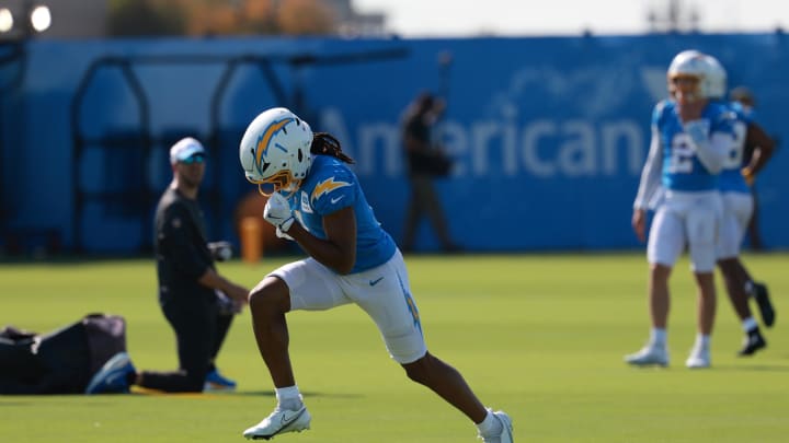 Jul 24, 2024; El Segundo, CA, USA;  Los Angeles Chargers wide receiver Quentin Johnston (1) runs with a ball during the first day of training camp at The Bolt. Mandatory Credit: Kiyoshi Mio-USA TODAY Sports