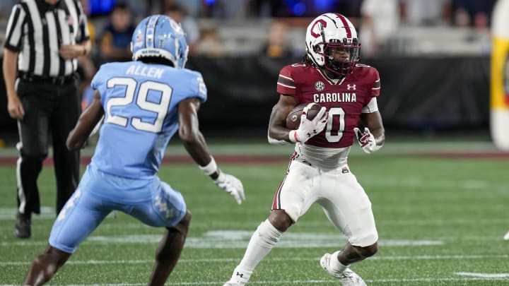 Sep 2, 2023; Charlotte, North Carolina, USA; North Carolina Tar Heels defensive back Marcus Allen (29) closes in on South Carolina Gamecocks running back Juju McDowell (0) during the second half at Bank of America Stadium. Mandatory Credit: Jim Dedmon-USA TODAY Sports