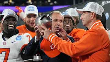 Dec 7, 2024; Charlotte, NC, USA; ACC commissioner James Phillips presents Clemson Tigers head coach Dabo Swinney with the trophy after the Tigers won the 2024 ACC Championship game against the Southern Methodist Mustangs at Bank of America Stadium. Mandatory Credit: Jim Dedmon-Imagn Images