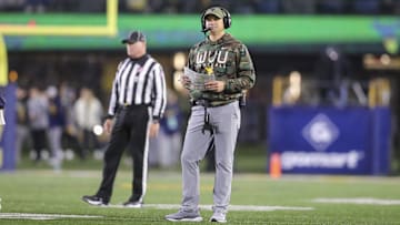 Nov 16, 2024; Morgantown, West Virginia, USA; West Virginia Mountaineers head coach Neal Brown walks along the field during the second quarter against the Baylor Bears at Mountaineer Field at Milan Puskar Stadium. Mandatory Credit: Ben Queen-Imagn Images
