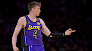 Apr 4, 2025; Los Angeles, California, USA;  Los Angeles Lakers guard Dalton Knecht (4) reacts after a 3-point basket in the first half against the New Orleans Pelicans at Crypto.com Arena. Mandatory Credit: Jayne Kamin-Oncea-Imagn Images