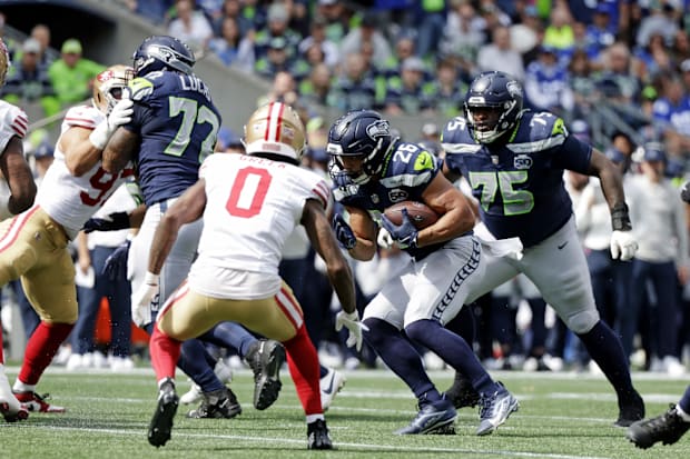 Seattle Seahawks running back Zach Charbonnet (26) runs the ball during the first half against San Francisco 49ers