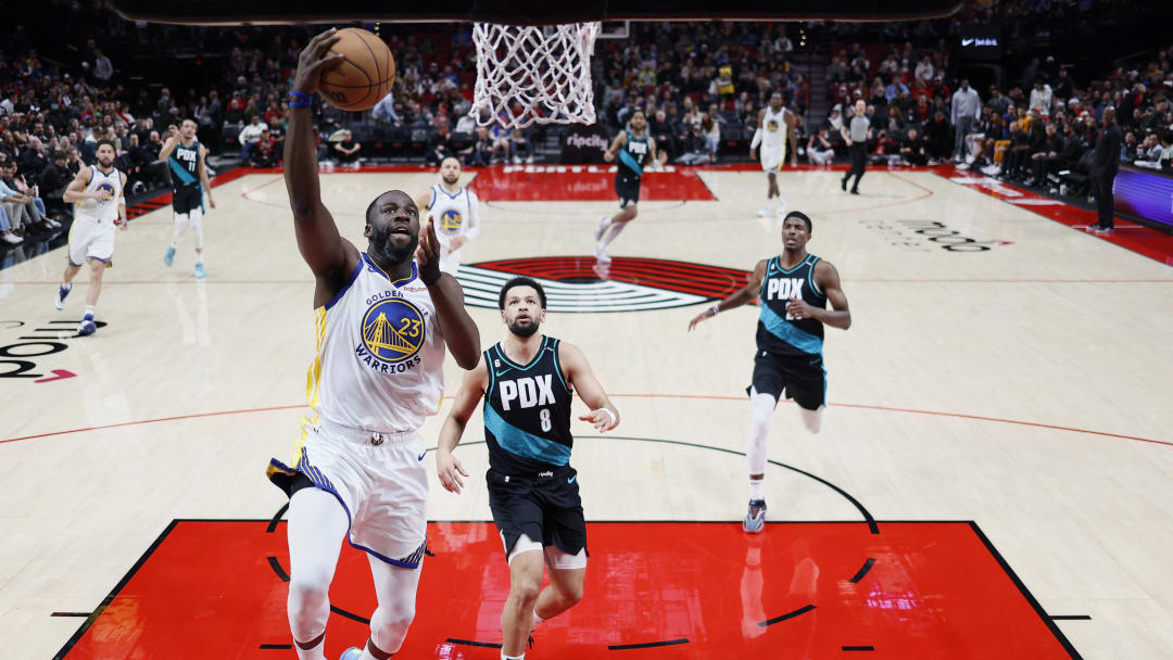 Apr 9, 2023; Portland, Oregon, USA; Golden State Warriors power forward Draymond Green (23) shoots the ball past Portland Trail Blazers guard Skylar Mays (8)during the second half at Moda Center. Mandatory Credit: Soobum Im-USA TODAY Sports