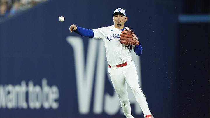 Jun 9, 2026; Toronto, Ontario, CAN; Toronto Blue Jays shortstop Andres Gimenez (0) throws out Philadelphia Phillies shortstop Trea Turner (not pictured) at first base during the third inning at Rogers Centre. Mandatory Credit: John E. Sokolowski-Imagn Images