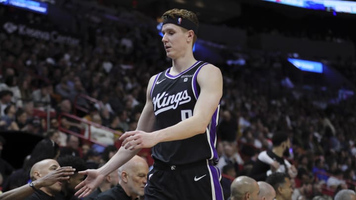 Jan 31, 2024; Miami, Florida, USA; Sacramento Kings guard Kevin Huerter (9) high-fives his teammates against the Miami Heat during the third quarter at Kaseya Center. Mandatory Credit: Sam Navarro-USA TODAY Sports