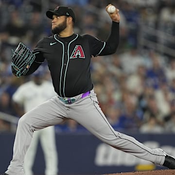 Jun 18, 2025; Toronto, Ontario, CAN; Arizona Diamondbacks starting pitcher Eduardo Rodriguez (57) pitches to the Toronto Blue Jays during the first inning at Rogers Centre. Mandatory Credit: John E. Sokolowski-Imagn Images