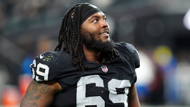  Las Vegas Raiders defensive tackle Adam Butler (69) smiles after the game against the Los Angeles Chargers in 2023.