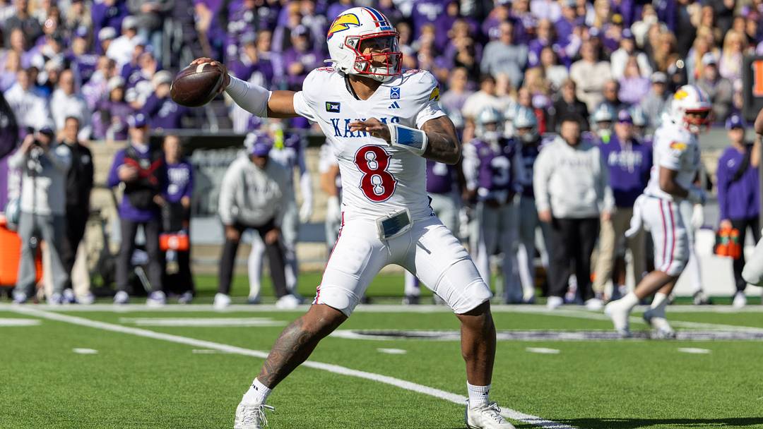 Oct 17, 2026; Manhattan, Kansas, USA; Kansas Jayhawks quarterback Isaiah Marshall (8) drops back to pass during the first quarter against the Kansas State Wildcats at Bill Snyder Family Football Stadium. Mandatory Credit: Scott Sewell-Imagn Images Oct 17, 2026; Manhattan, Kansas, USA; Kansas Jayhawks quarterback Isaiah Marshall (8) drops back to pass during the first quarter against the Kansas State Wildcats at Bill Snyder Family Football Stadium. Mandatory Credit: Scott Sewell-Imagn Images