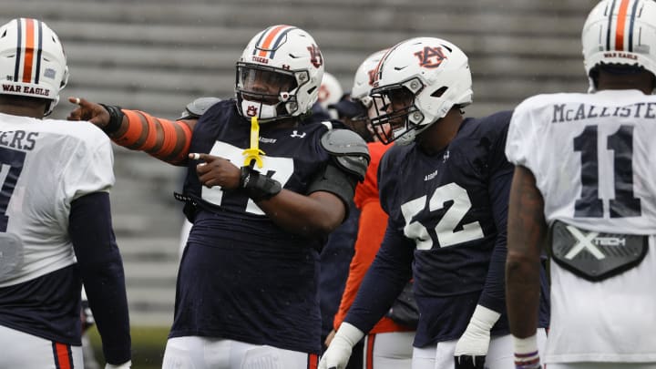 Auburn Tigers senior offensive linemen including Jeremiah Wright (77) and Dillon Wade (52) can leave a lasting legacy in 2024.