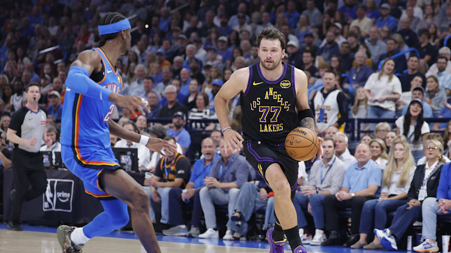 Lakers guard Luka Dončić drives to the basket against Thunder guard Shai Gilgeous-Alexander during their April 2 game.