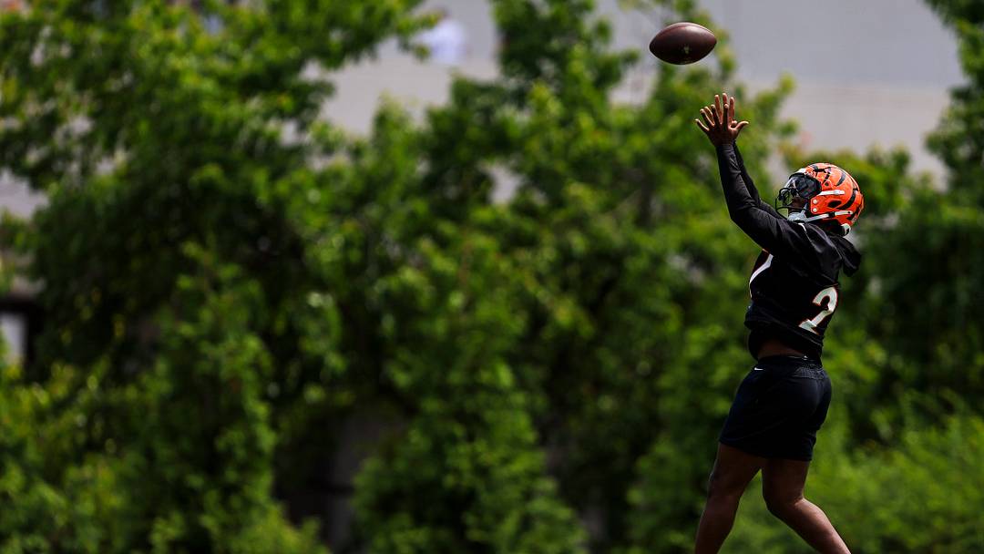 Jun 16, 2026; Cincinnati, OH, USA; Cincinnati Bengals safety Jordan Battle (27) catches a pass during minicamp at Kettering Health Practice Fields. Mandatory Credit: Katie Stratman-Imagn Images