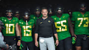 Oregon coach Dan Lanning leads his team onto the field before the game against Colorado in Eugene Saturday, Sept. 23, 2023.