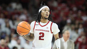 Jan 11, 2025; Fayetteville, Arkansas, USA; Arkansas Razorbacks guard Boogie Fland (2) dribbles during the first half against the Florida Gators at Bud Walton Arena. Mandatory Credit: Nelson Chenault-Imagn Images