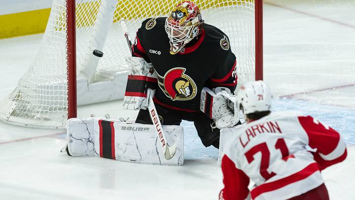 Mar 10, 2025; Ottawa, Ontario, CAN; Detroit Red Wings center Dylan Larkin (71) scores against Ottawa Senators goalie Linus Ullmark (35) in the third period at the Canadian Tire Centre. Mandatory Credit: Marc DesRosiers-Imagn Images