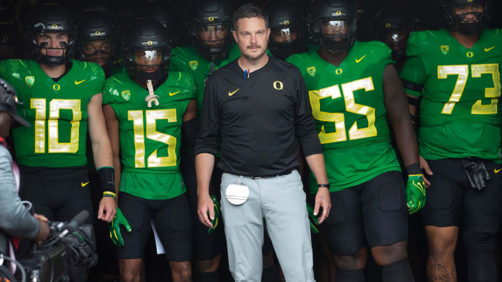 Oregon coach Dan Lanning leads his team onto the field before the game against Colorado in Eugene Saturday, Sept. 23, 2023.